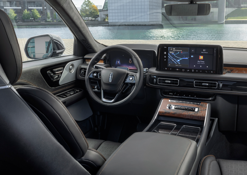The interior of the 2025 Lincoln Aviator® SUV is shown parked with a view of a harbor through the windshield. | Joe Rizza Lincoln of Orland Park in Orland Park IL