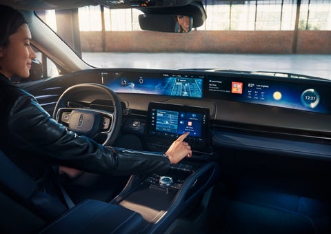 The driver of a 2025 Lincoln Nautilus® SUV interacts with the center touchscreen. | Joe Rizza Lincoln of Orland Park in Orland Park IL