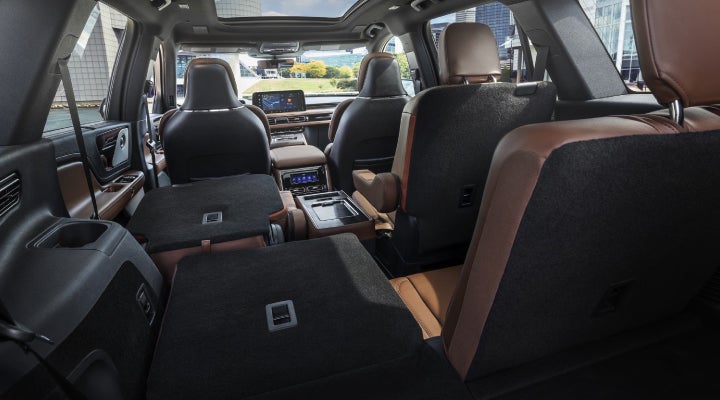 One side of the PowerFold® third-row seat and a second-row seat are folded forward in the 2026 Lincoln Aviator® SUV. | Joe Rizza Lincoln of Orland Park in Orland Park IL