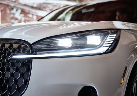 A close-up of a headlamp on the 2027 Lincoln Aviator® SUV is shown. | Joe Rizza Lincoln of Orland Park in Orland Park IL