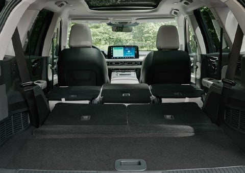 A rear to front view of the interior of a 2027 Lincoln Aviator® Black Label™ SUV shows the third and second rows folded flat | Joe Rizza Lincoln of Orland Park in Orland Park IL